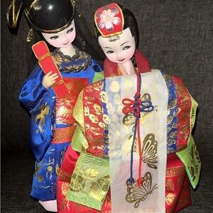 Traditional Japanese Dolls in Vibrant Attire